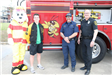 Fire truck, mascot, and team members