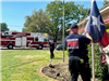 Firefighter adjusting a flag