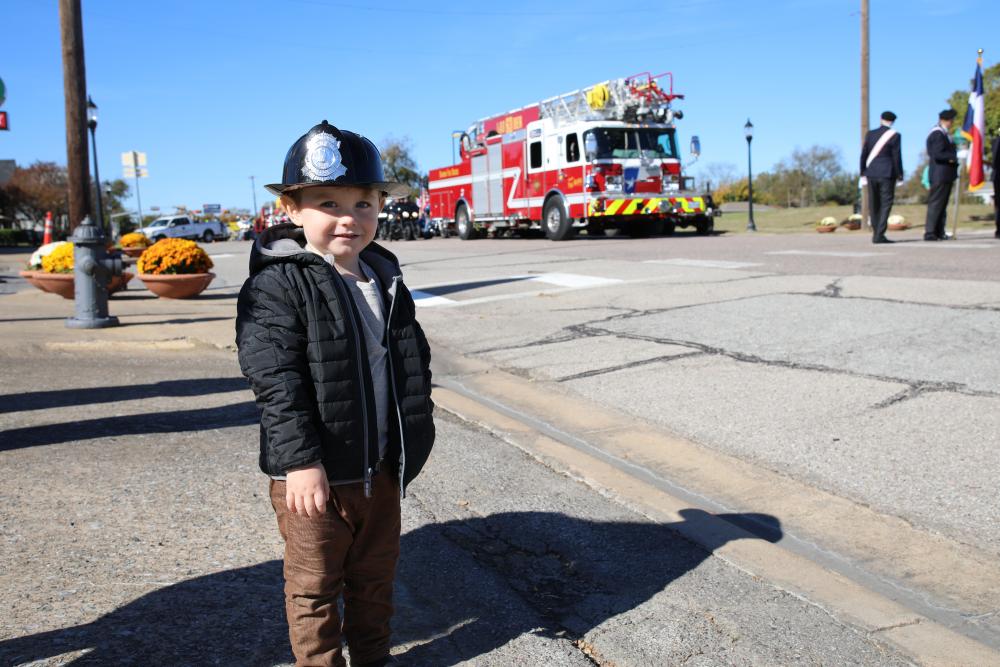 Child in firefighter cap