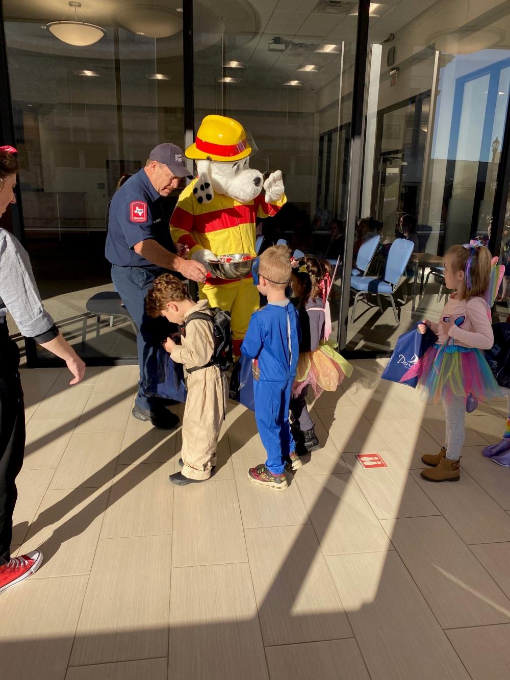 Fire mascot and children