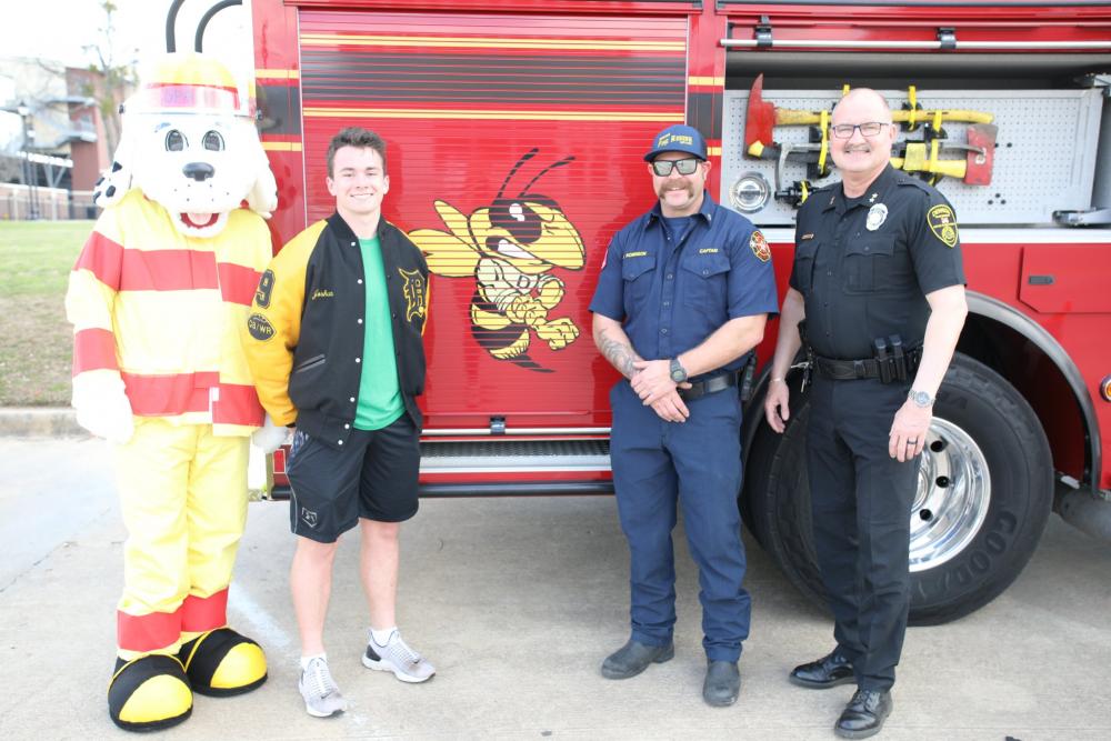Fire truck, mascot, and team members