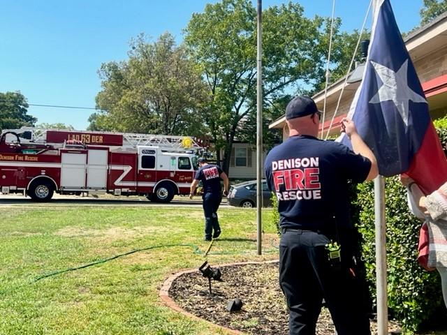 Firefighter adjusting a flag