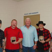 Fire staff, two holding awards
