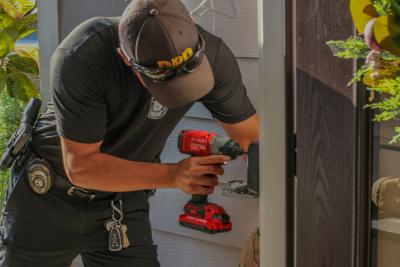 Officer installing a lockbox